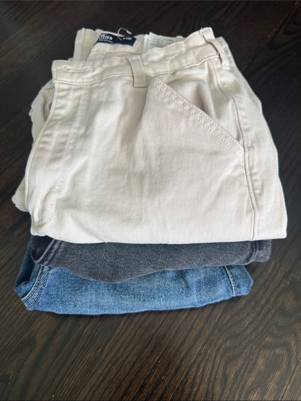 Hollister Women's Jeans Stack in Cream, Black, and Blue